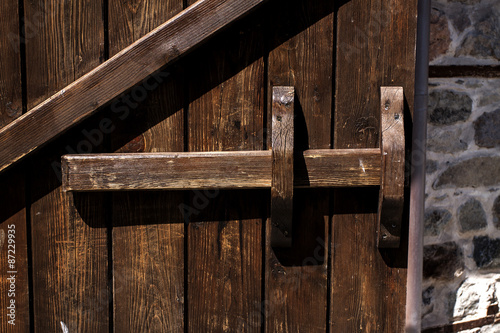 Old wooden door with wooden latch