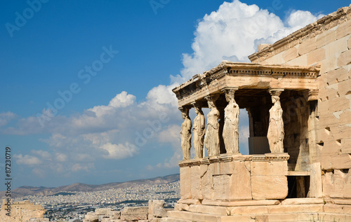 Caryatids portico on Acropolis and Athens view.