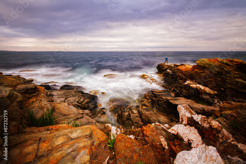 Sunset on a rocky shore.