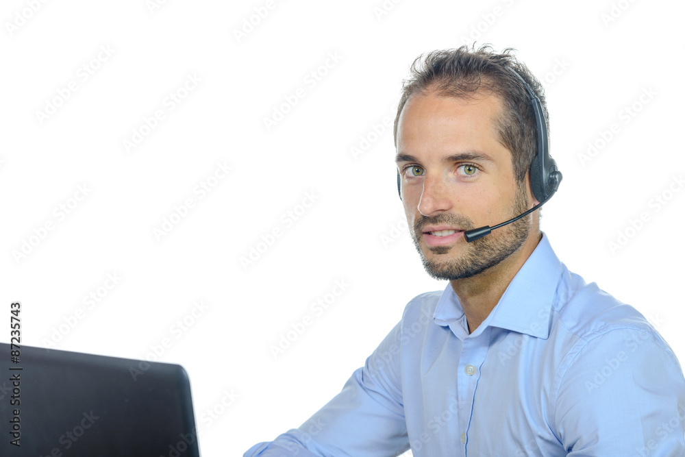 Handsome customer service operator wearing a headset Handsome customer service operator wearing a headset