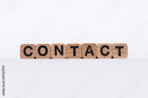contact - text on wooden cubes, isolated on white background
