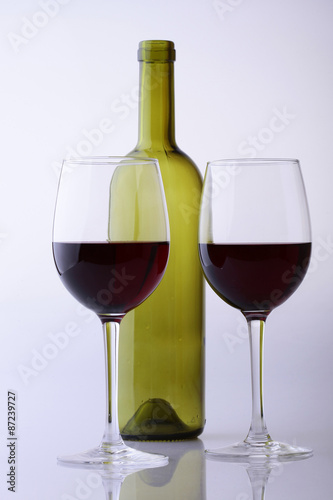 Empty bottle and glasses with wine