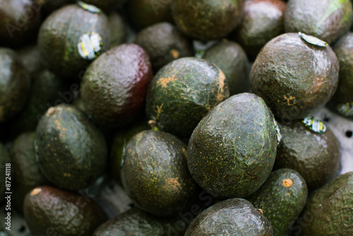 Stacked Avocados in Grocery Store