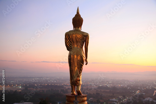 behind Buddha statue before sunrise time