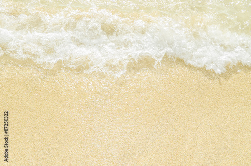 White sand and waves splash