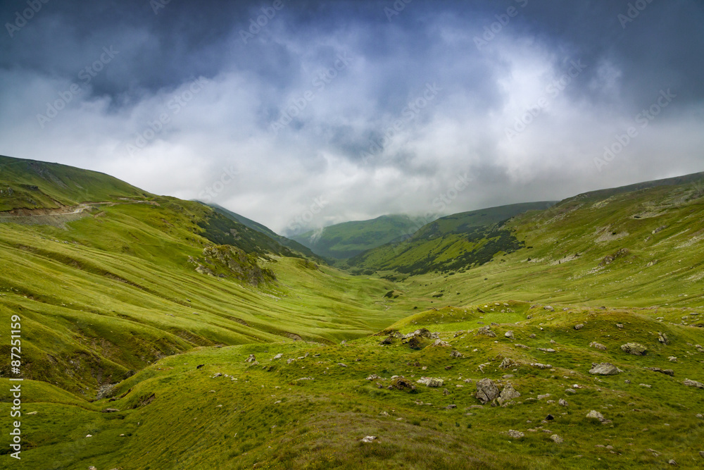 Dramatic clouds and mountain landscape Dramatic clouds and mountain landscape