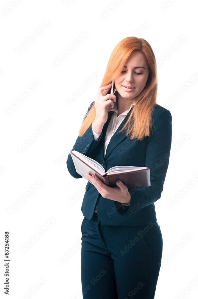 Red-haired businesswoman with a diary in hands Red-haired businesswoman with a diary in hands