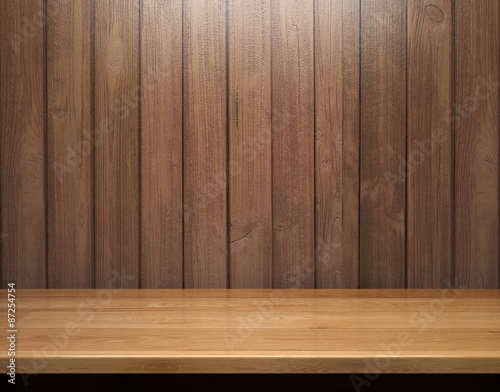 Empty shelf on wooden plank wall