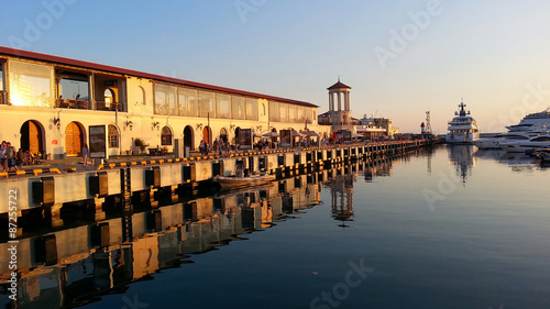 Sochi seaport shallow dock, water reflections