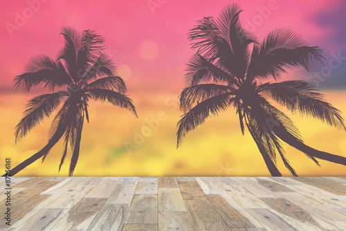 Wooden terrace with coconut palms silhouette  Vintage color style. Summer concept 