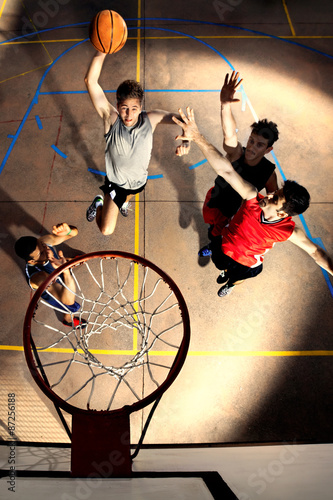 young basketball players playing with energy