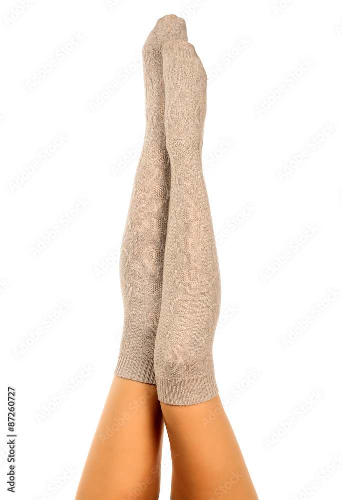 Long female legs in knitted socks