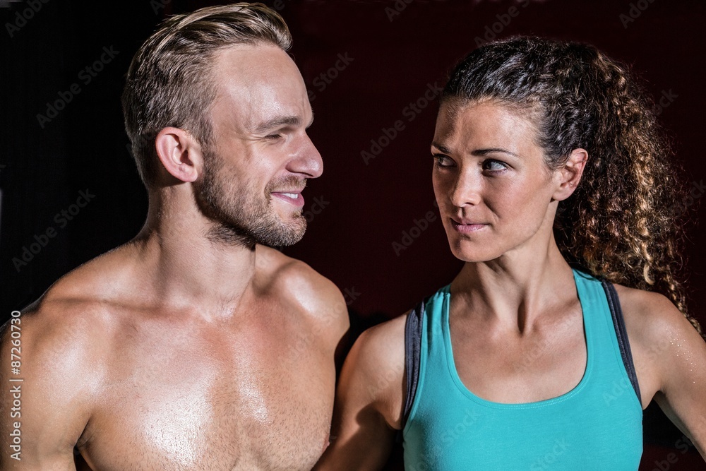 Muscular couple looking at each other Muscular couple looking at each other