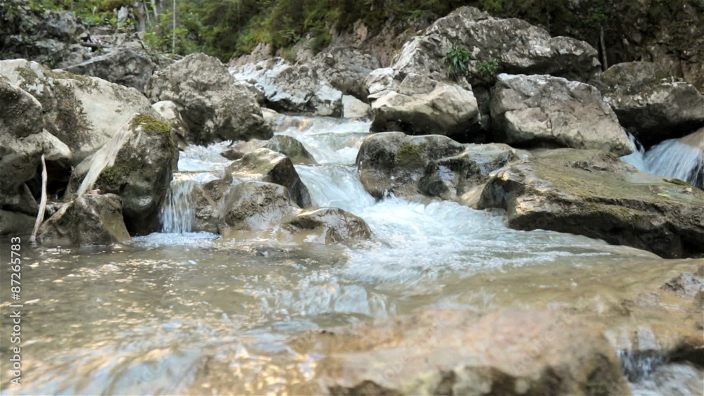Raging clean fresh mountain river between rocks Raging clean fresh mountain river between rocks