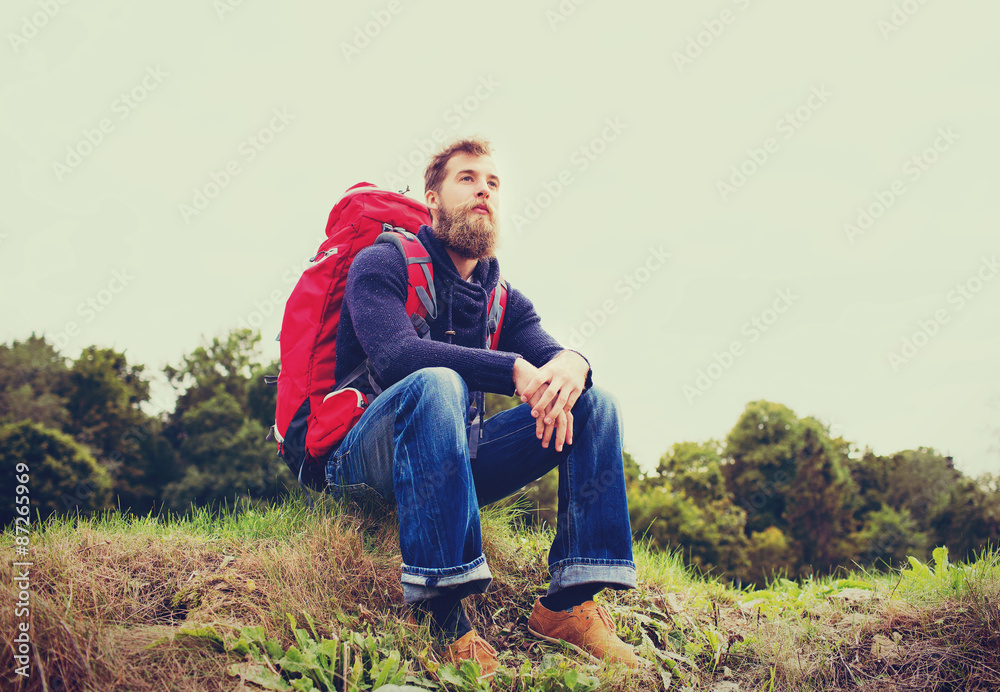 man with backpack hiking