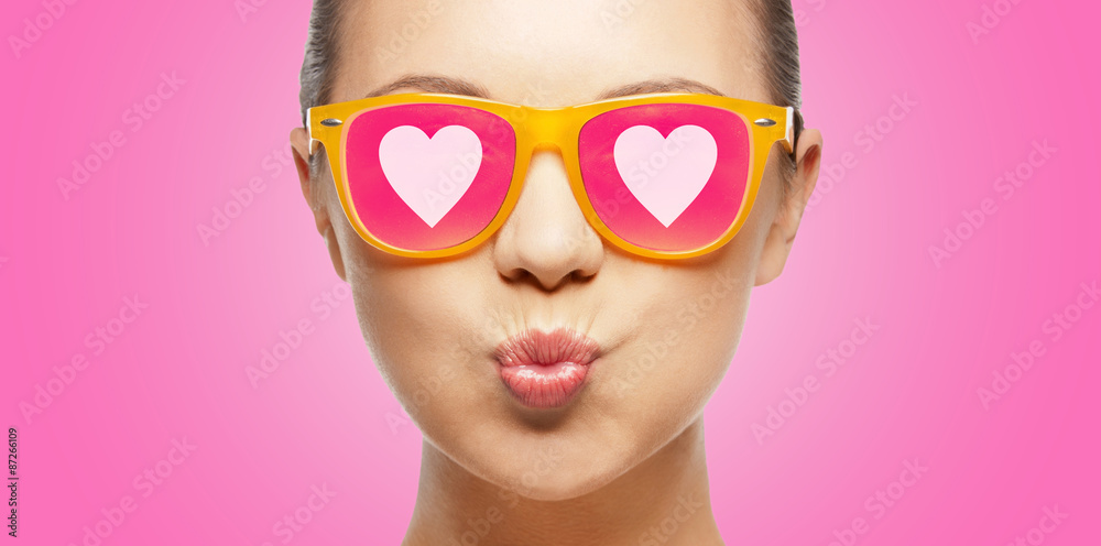 girl in pink sunglasses blowing kiss girl in pink sunglasses blowing kiss