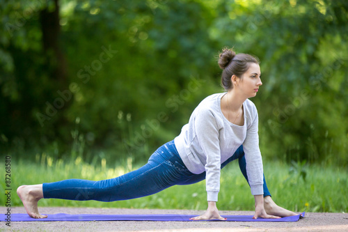 Stretching exercises in park alley © fizkes