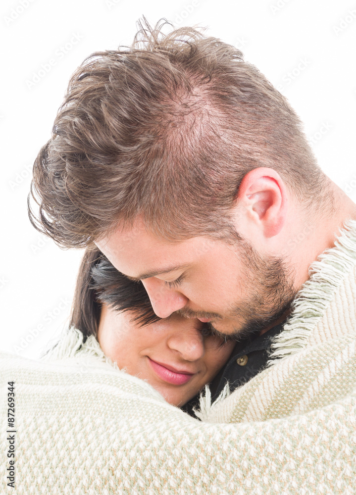 Fototapeta premium Couple in love covered with a blanket