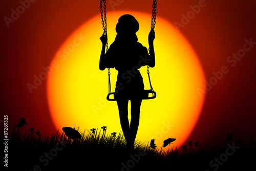 silhouette of cute girl play swing on sunset background
