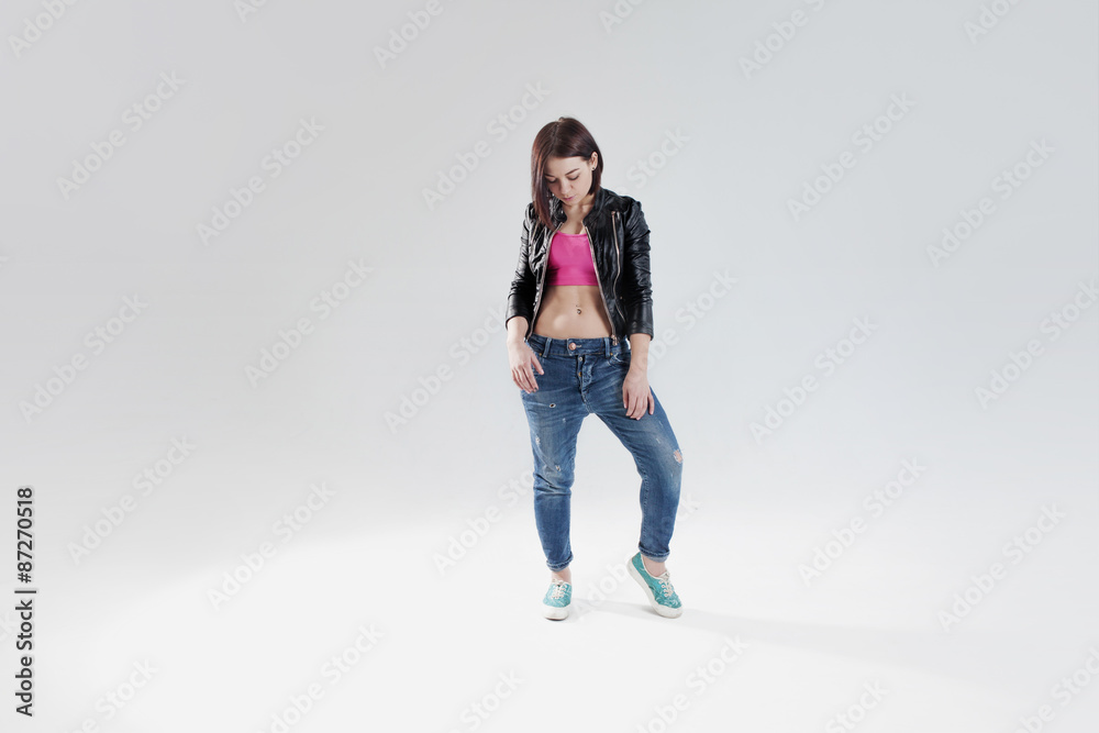 young woman hip hop dancer, in the Studio on a white background young woman hip hop dancer, in the Studio on a white background