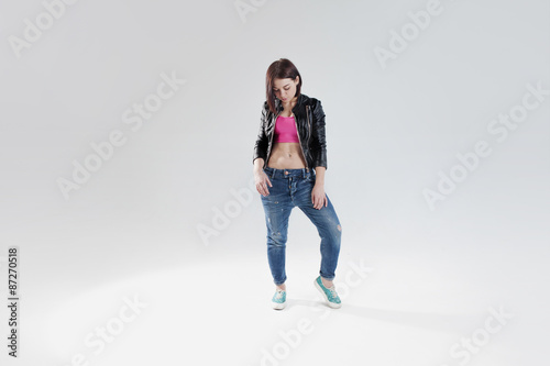 young woman hip hop dancer, in the Studio on a white background