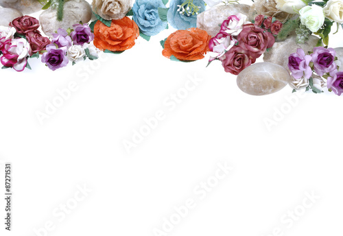 Artificial flowers with stone on white background