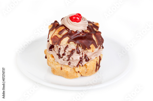 Wallpaper Mural Chocolate Creampuff – A single chocolate creampuff, with whipped cream and a maraschino cherry on top. On a white plate, on a white background. Torontodigital.ca