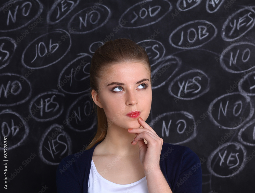 Thinking young woman with yes or no choice on grey background Thinking young woman with yes or no choice on grey background
