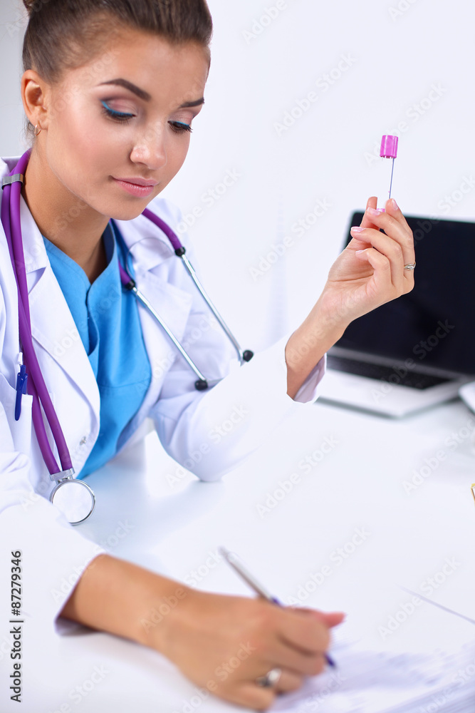 Woman researcher is surrounded by medical vials and flasks Woman researcher is surrounded by medical vials and flasks