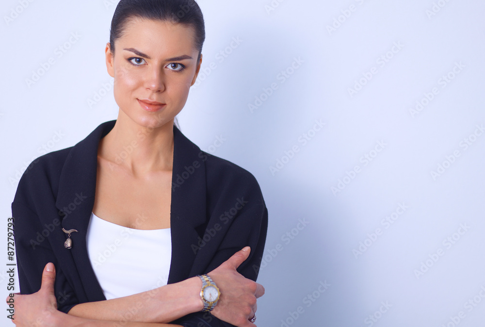 Young woman standing, isolated on gray background Young woman standing, isolated on gray background