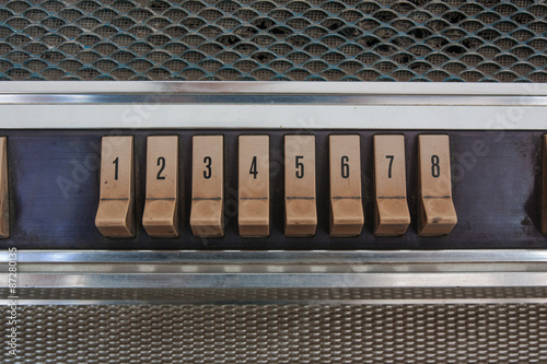 Push button juke box have dust and stain.