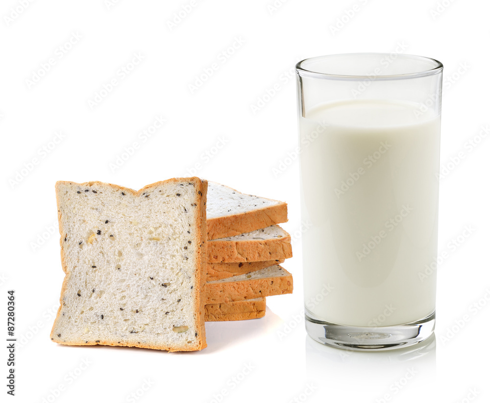 Glass of milk and whole wheat bread isolated on white background Glass of milk and whole wheat bread isolated on white background