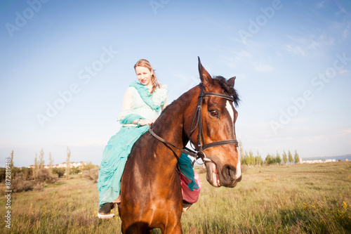 Horsewoman and blue sky