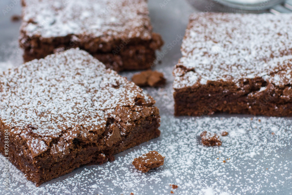 Brownie. Chocolate cakes with powdered sugar
