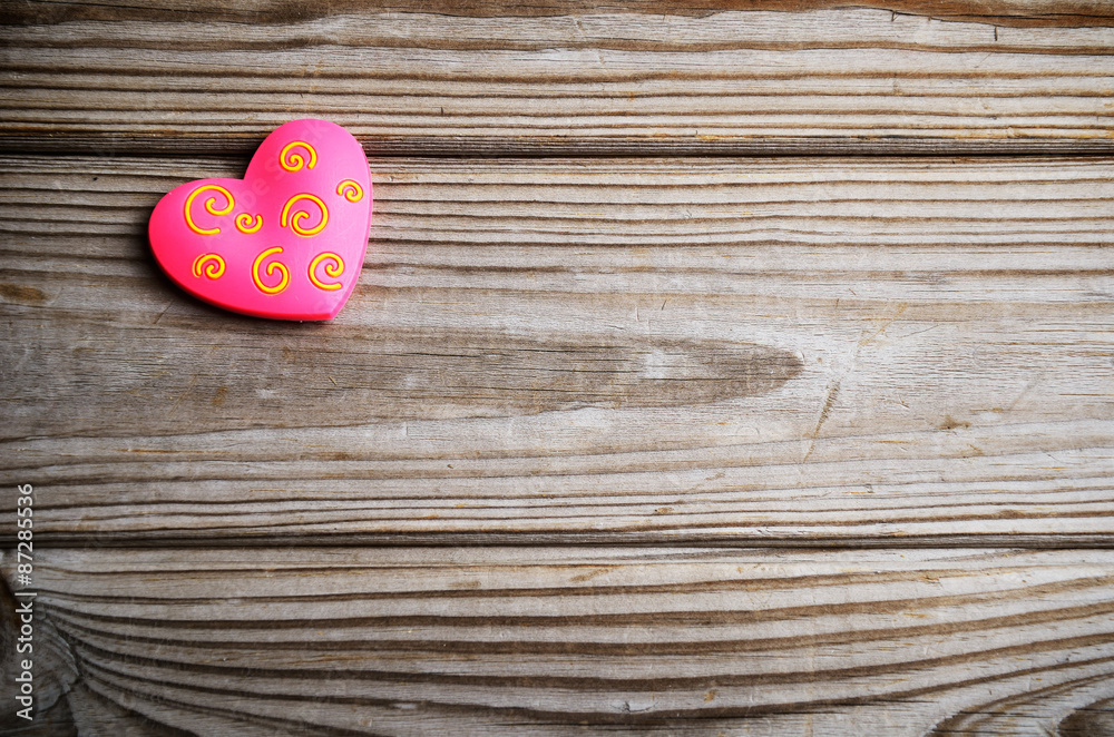 pink heart on a wooden background. horizontal pink heart on a wooden background. horizontal