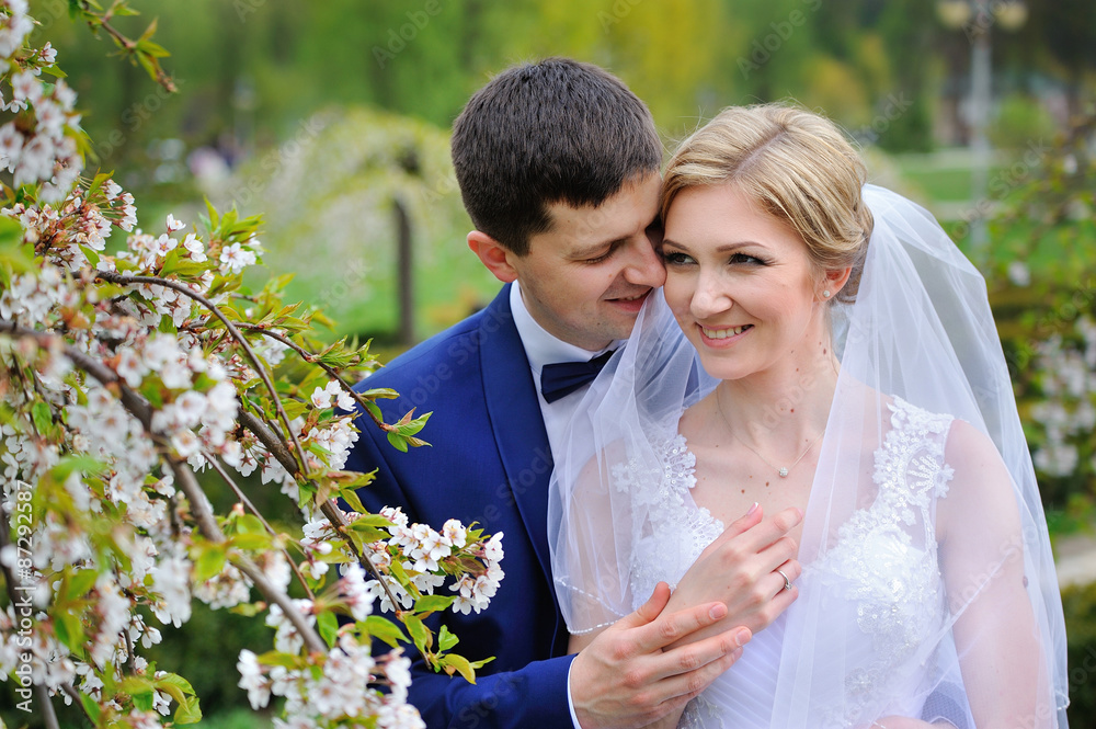 Portrait of bride and groom in the spring bloom Portrait of bride and groom in the spring bloom