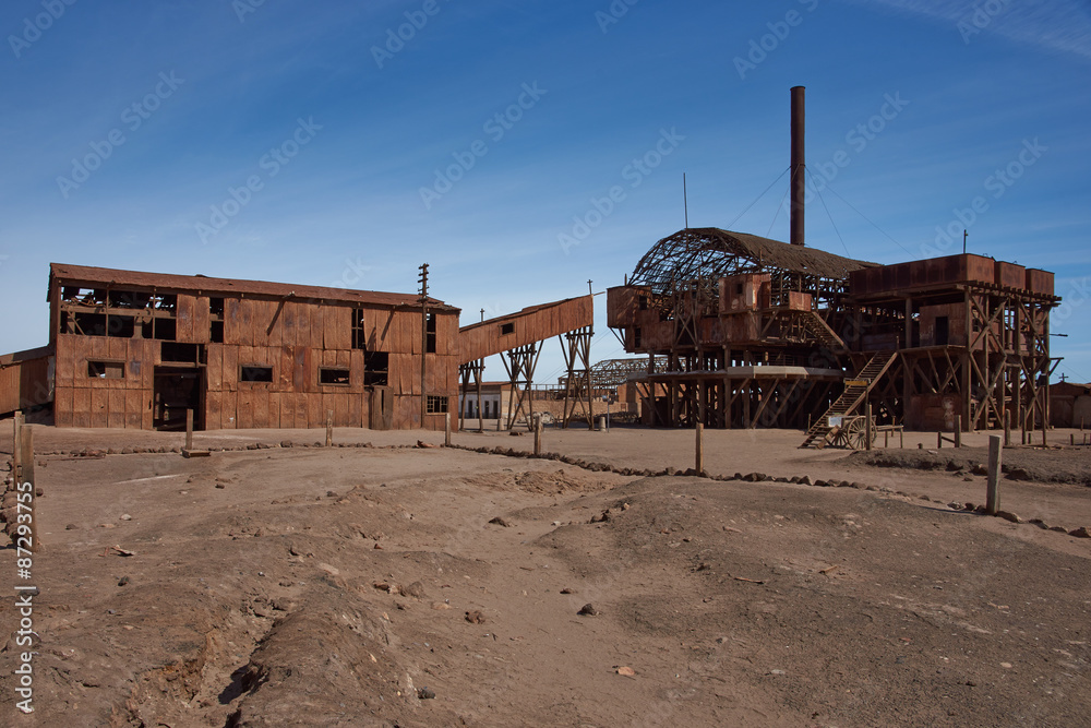 Derelict and rusting leaching plant at the historic Santa Laura Saltpeter Works in the Atacama Desert near Iquique in Chile. The site is now an open air museum and a Unesco World Heritage SIte. Derelict and rusting leaching plant at the historic Santa Laura Saltpeter Works in the Atacama Desert near Iquique in Chile. The site is now an open air museum and a Unesco World Heritage SIte.
