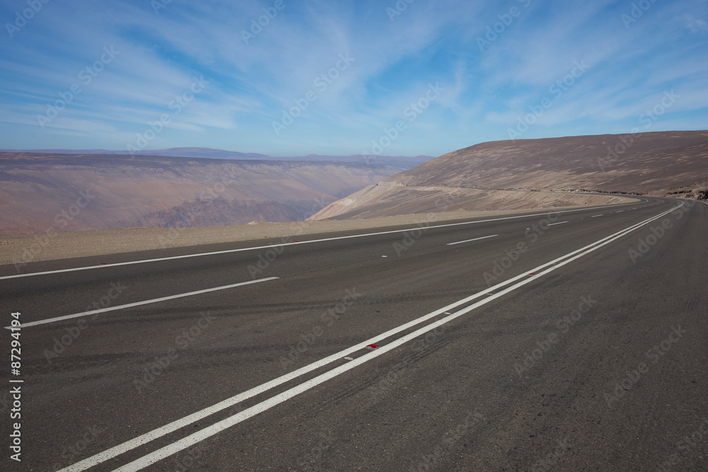 Pan American Highway (Route 5) running south to north for over 3000 km through Chile as it passes through the valley of the Rio Camarones in the Atacama Desert close to Arica in northern Chile.
