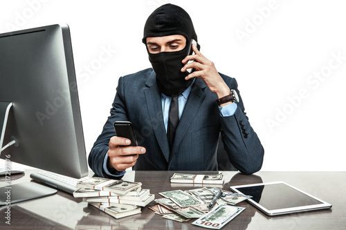 Masked anonymous businessman wearing balaclava helmet