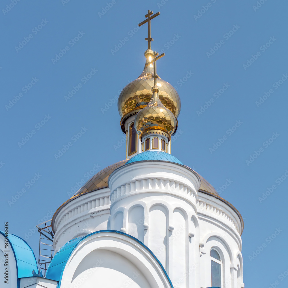 Russian church close view to the roof with a blue sky