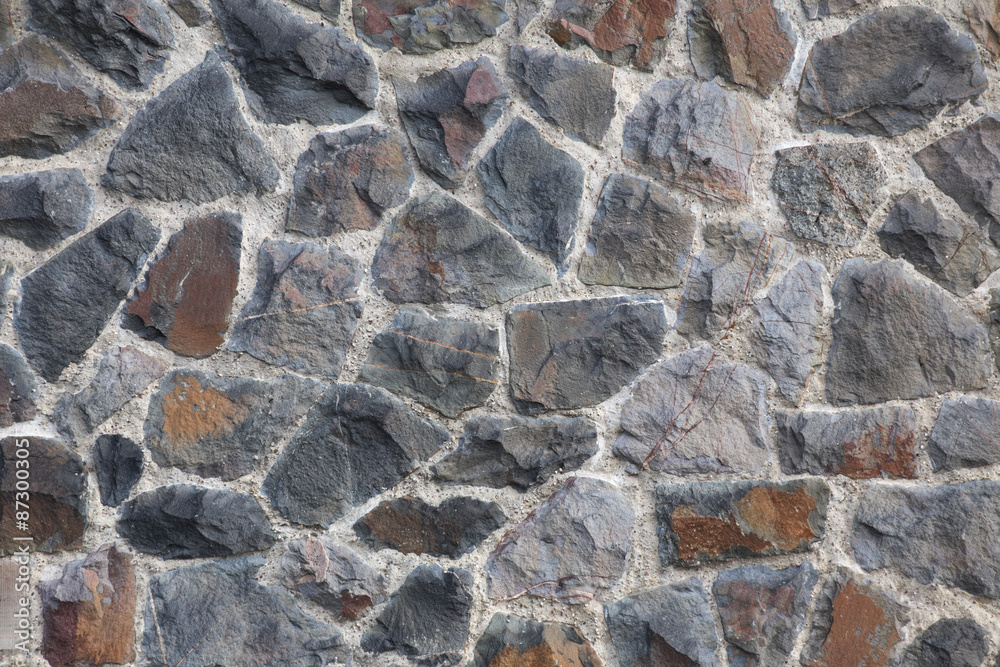 A fieldstone wall texture usable as background A fieldstone wall texture usable as background