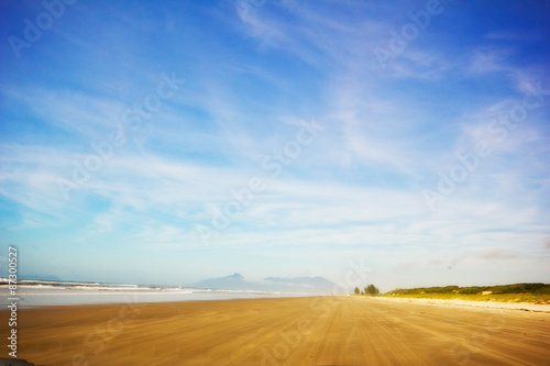 Ilha Comprida beach, São Paulo - Brazil. Waves in a sunny day at the end of brazilian island. photo