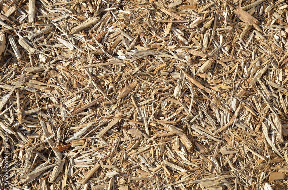 Garden mulch in a chaotic seamless background Garden mulch in a chaotic seamless background