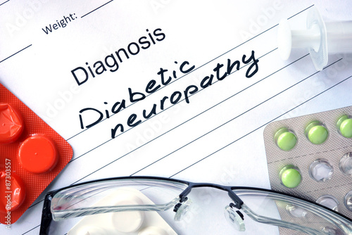 Diagnosis  Diabetic neuropathy, pills and stethoscope. photo