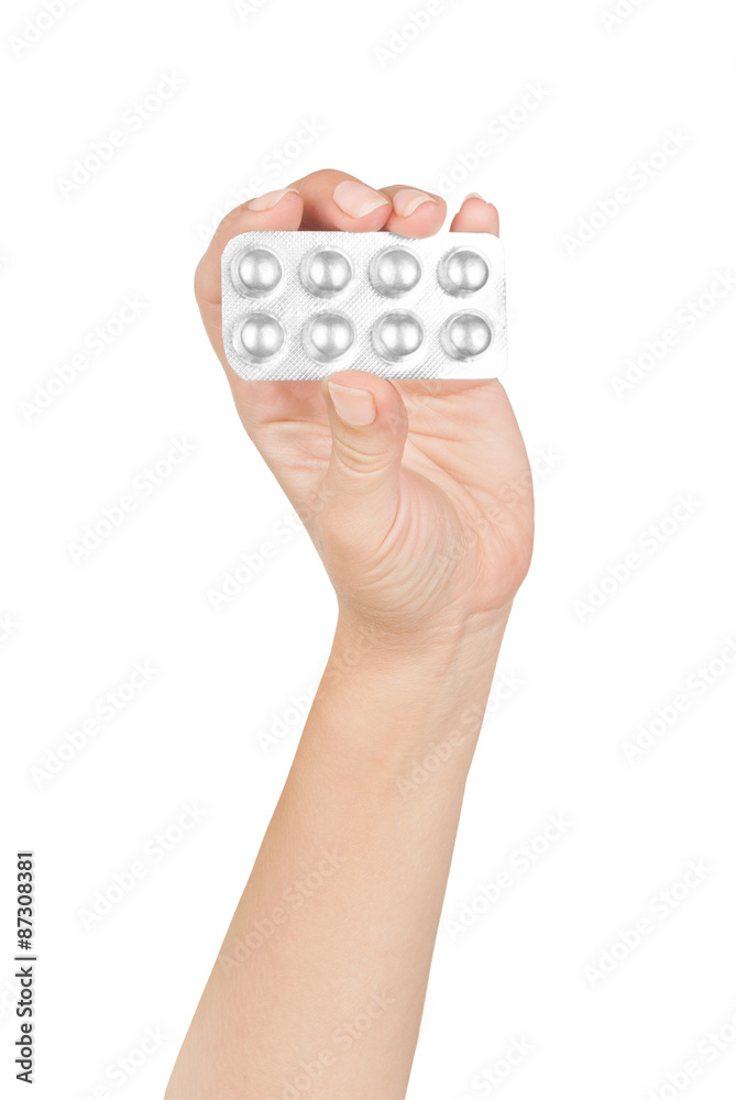 Woman holding pills. Isolated on a white background. Woman holding pills. Isolated on a white background.