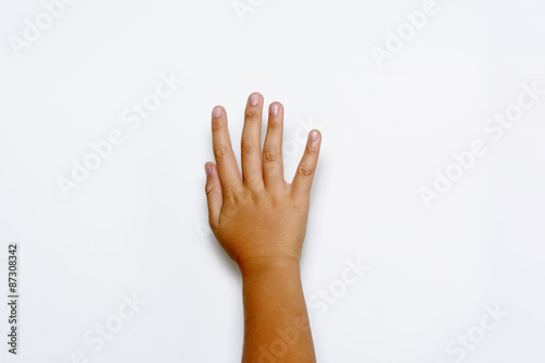 Boy raising five fingers up on hand on white background.   © dsom