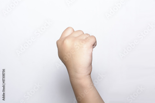 Girl raising fist hand on white backgrounds 