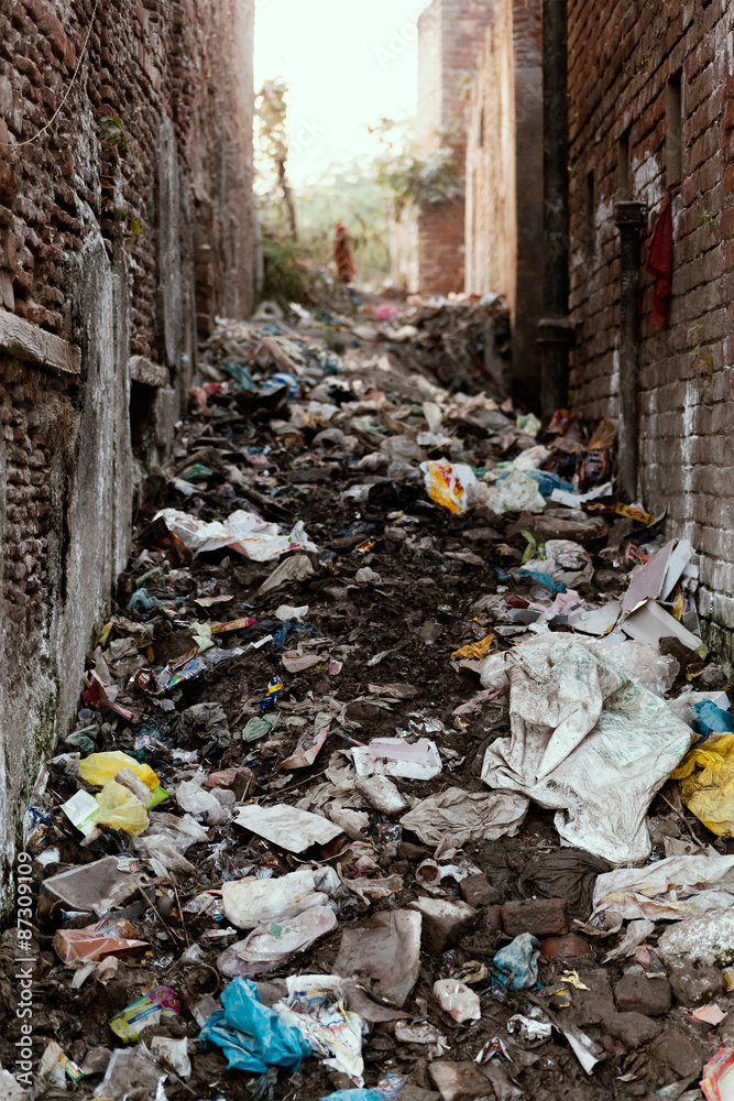 Slums Garbage Social Issue, Big garbage heap in between buildings of Indian slums ...