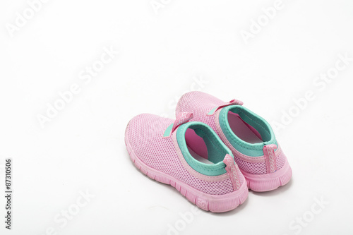 pink baby sneakers on white background