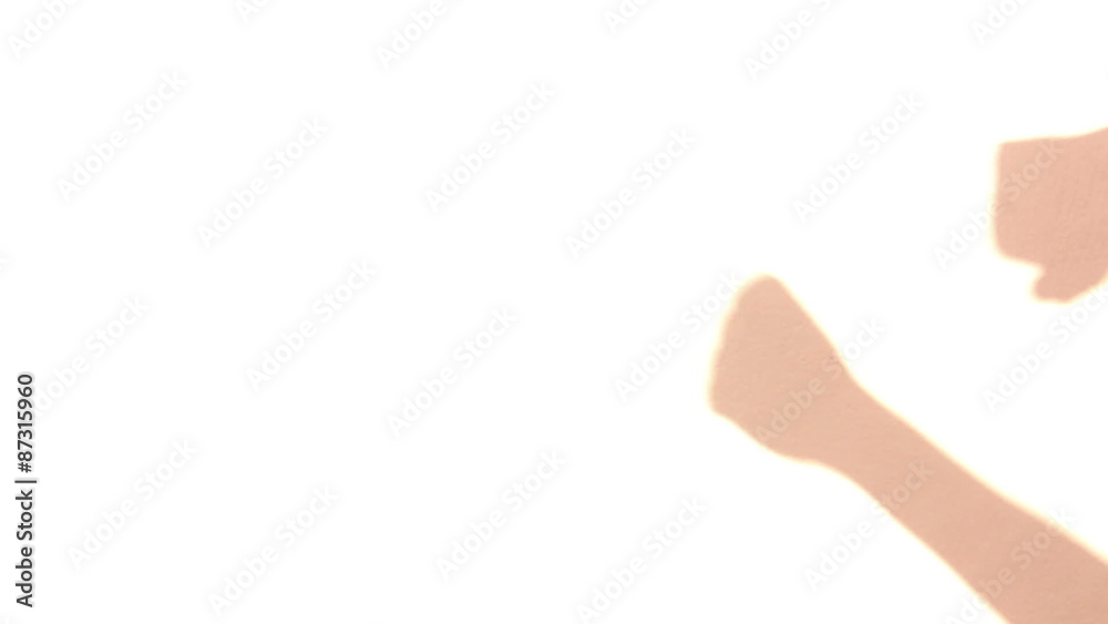 Fist fights pink shadow on white isolated background Fist fights pink shadow on white isolated background